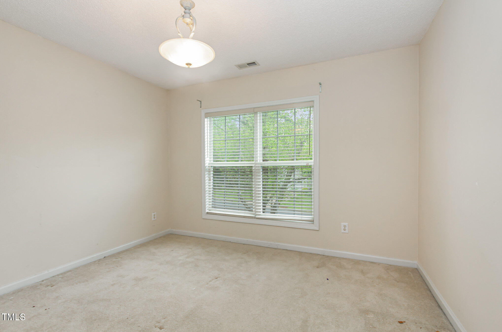 401 Stinhurst Drive Durham, NC 27713 - Photo 23 of 39 an empty room with a window