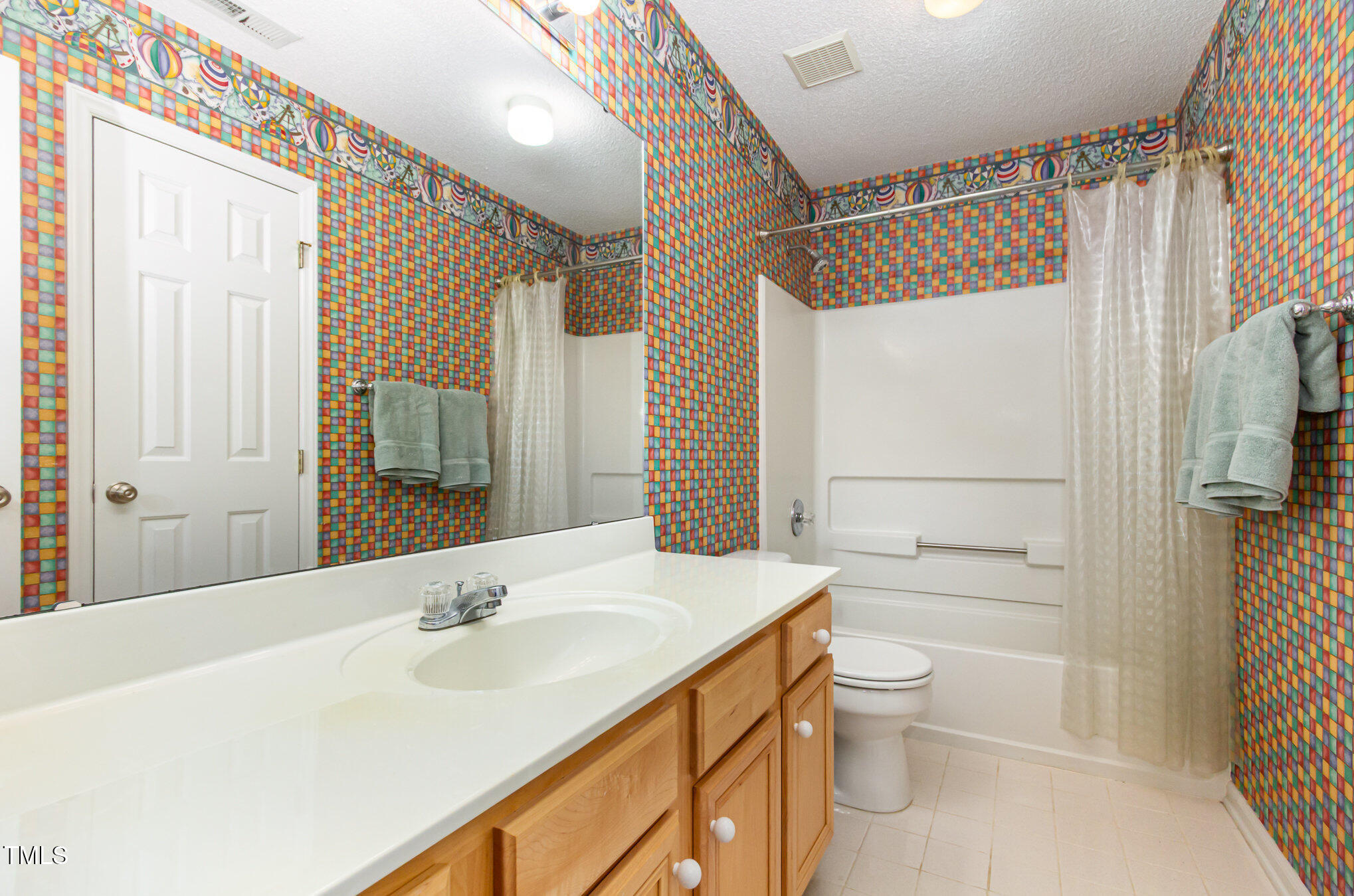 401 Stinhurst Drive Durham, NC 27713 - Photo 25 of 39 a bathroom with a sink a toilet and shower