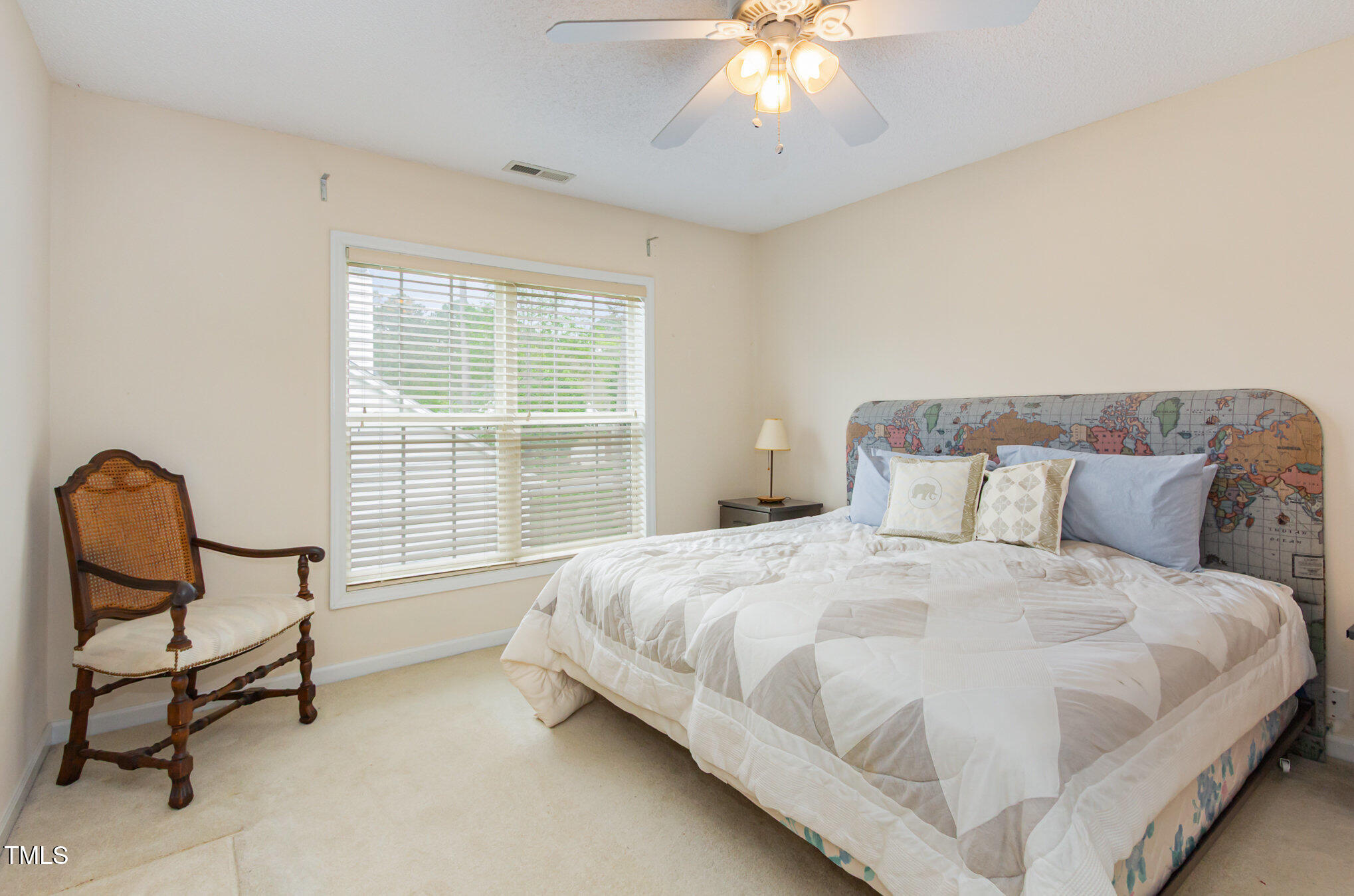 401 Stinhurst Drive Durham, NC 27713 - Photo 30 of 39 a bedroom with a bed chair and two window