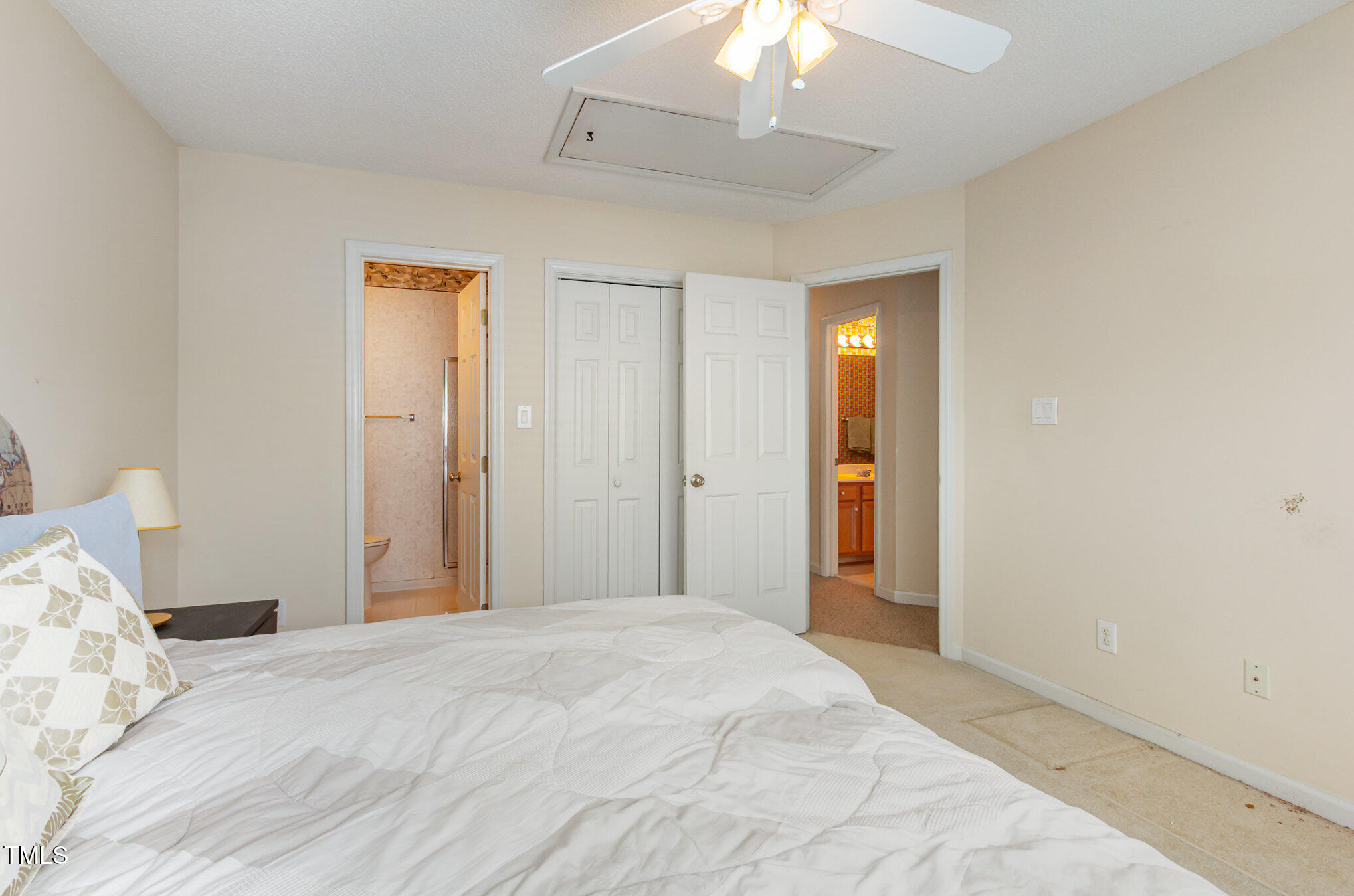 401 Stinhurst Drive Durham, NC 27713 - Photo 31 of 39 a bedroom with a bed and a chandelier