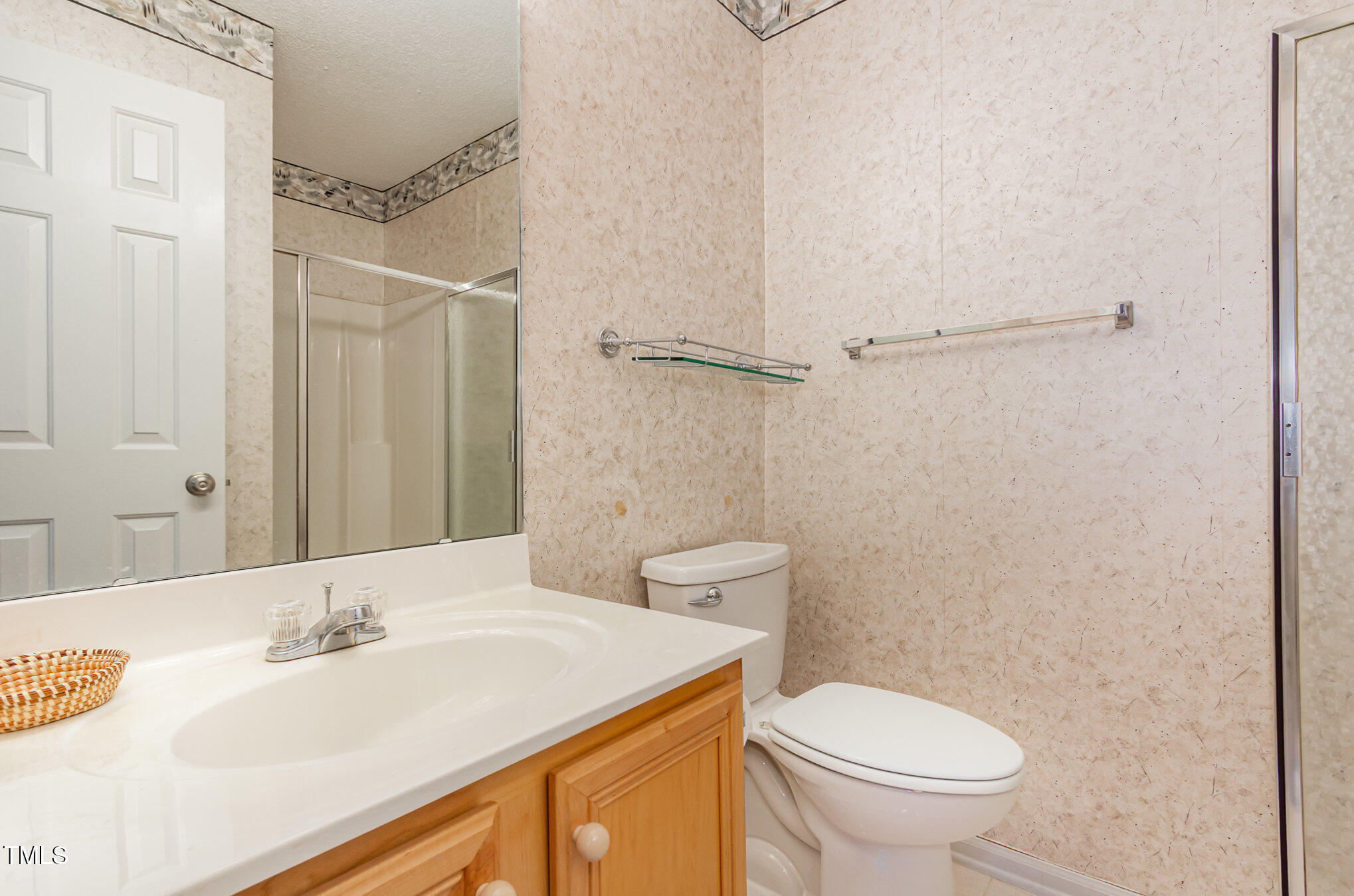 401 Stinhurst Drive Durham, NC 27713 - Photo 32 of 39 a bathroom with a sink a toilet and shower