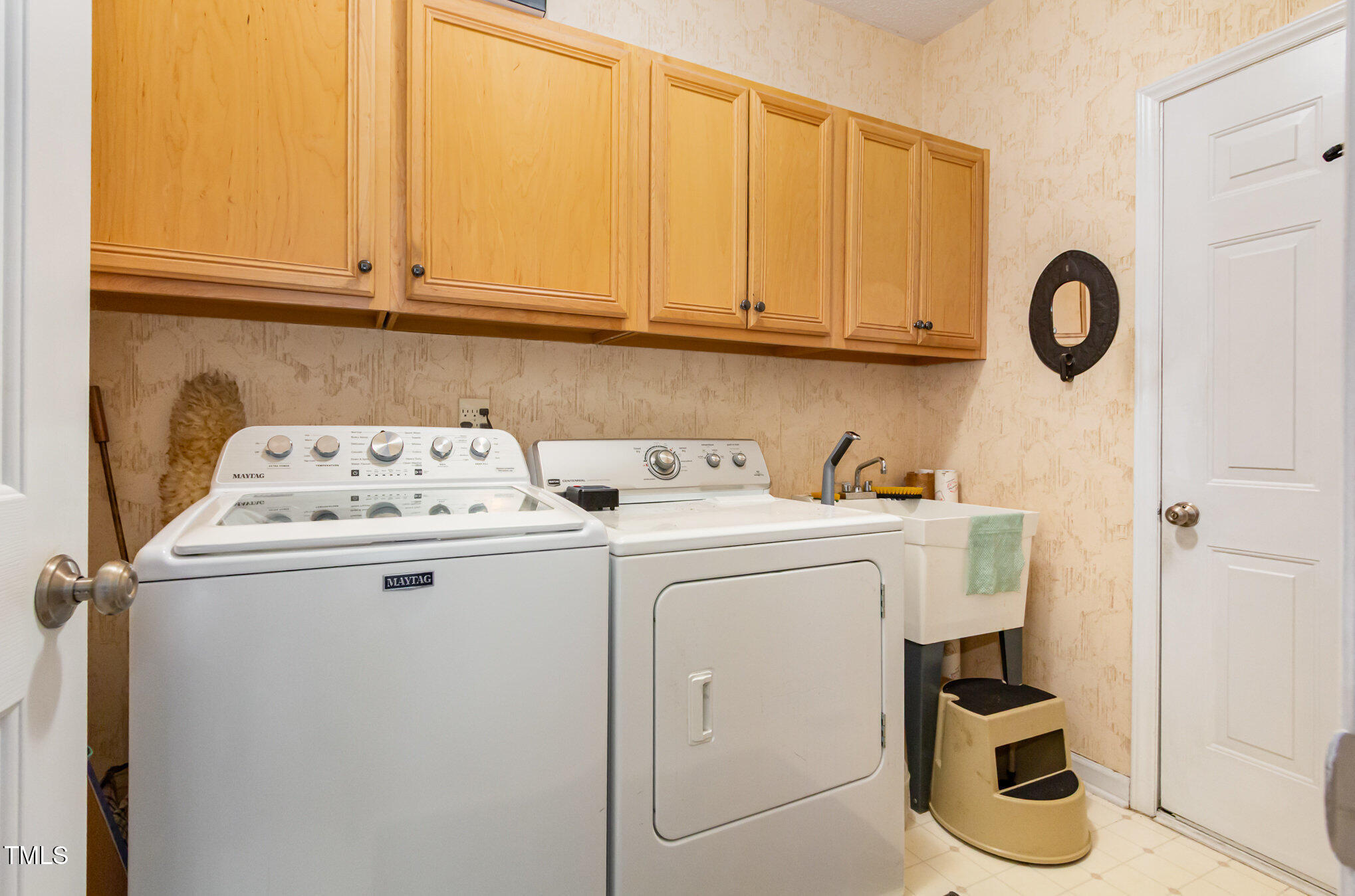 401 Stinhurst Drive Durham, NC 27713 - Photo 33 of 39 a utility room with dryer and washer