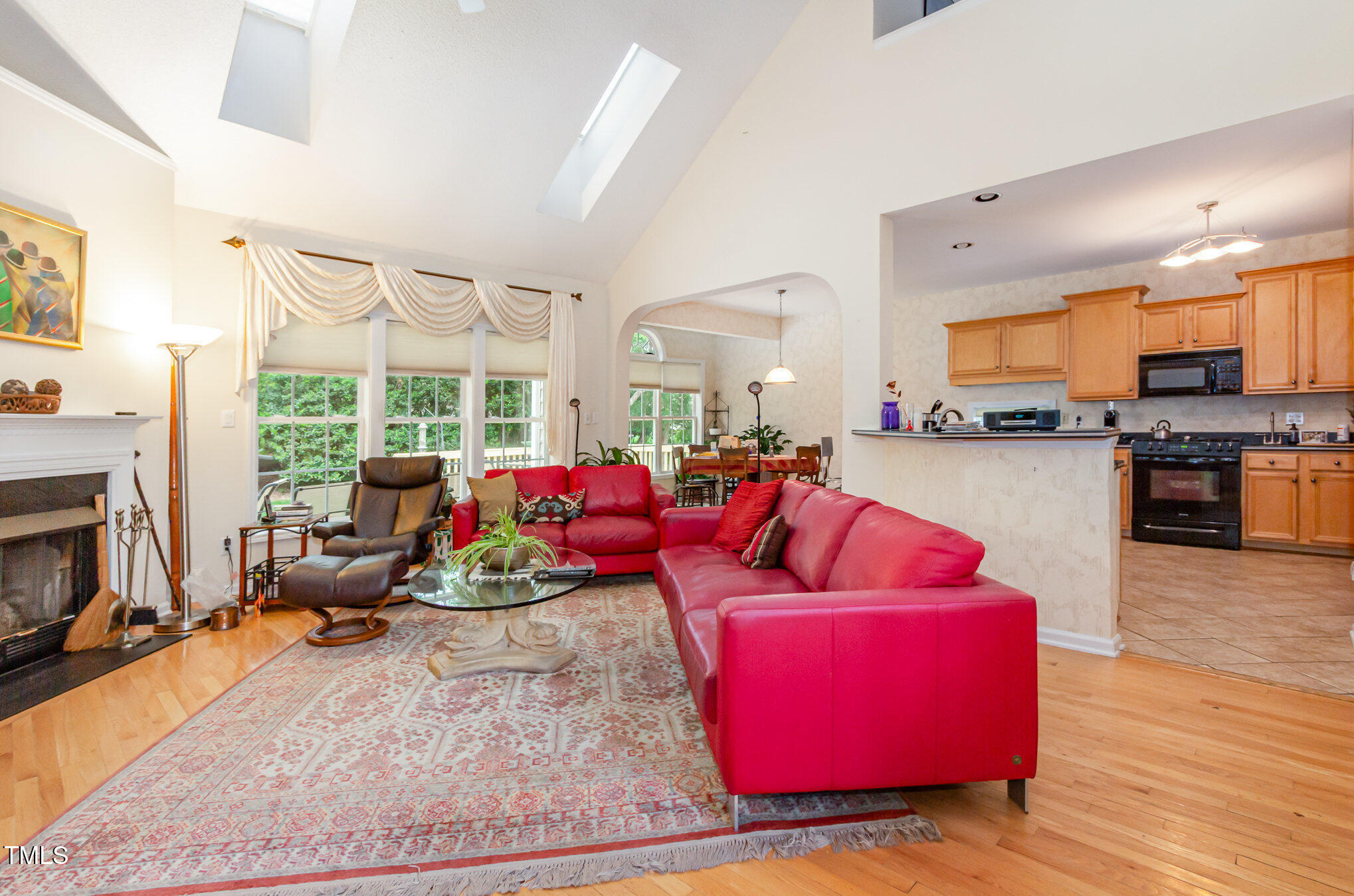 401 Stinhurst Drive Durham, NC 27713 - Photo 6 of 39 a living room with furniture and a fireplace