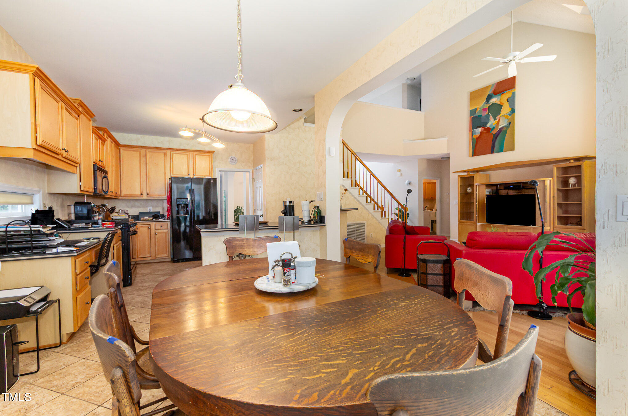 401 Stinhurst Drive Durham, NC 27713 - Photo 7 of 39 a living room with furniture a flat screen tv and kitchen view