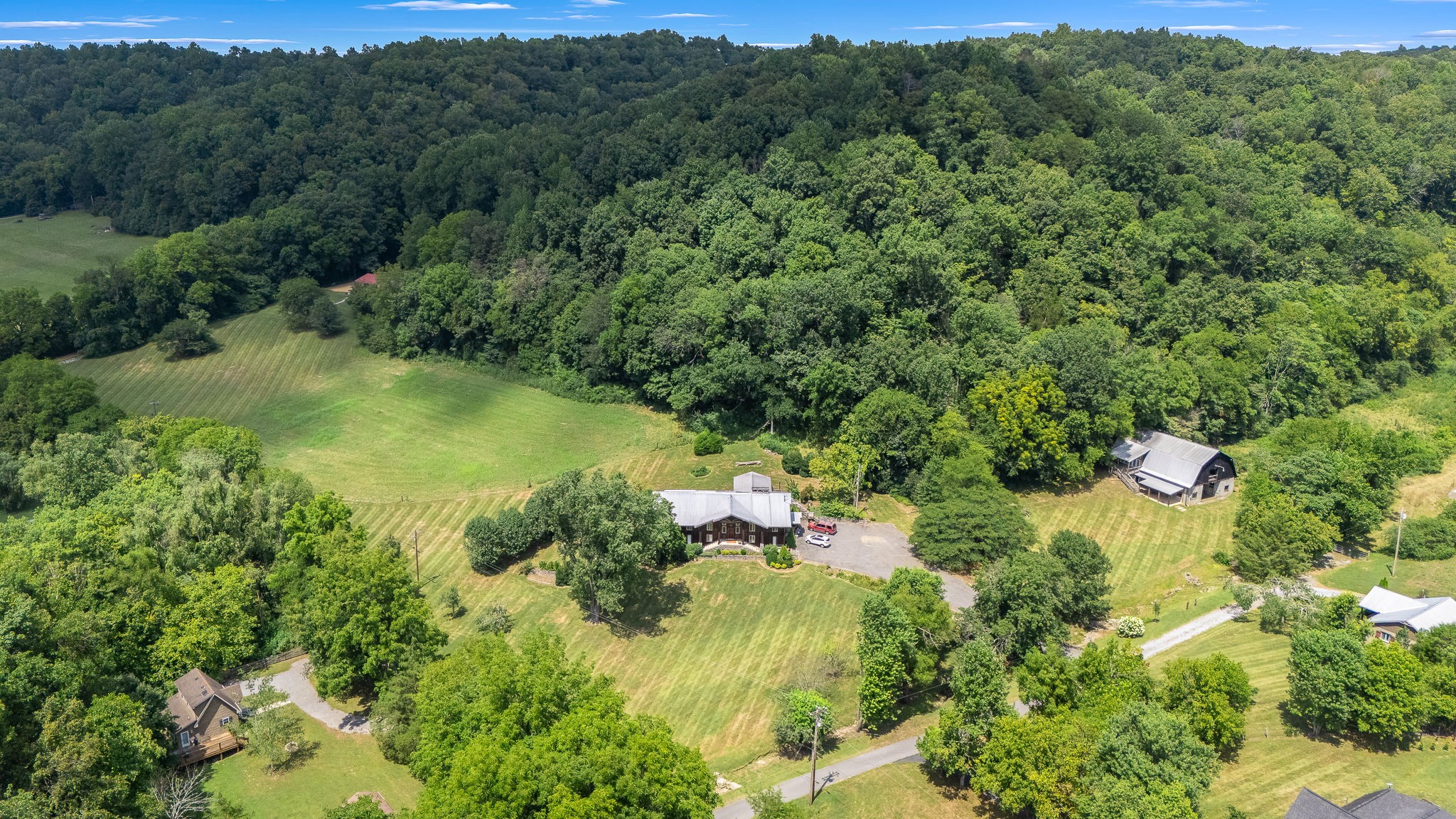 0 Cascade Hollow Road Normandy, TN 37360 - Photo 2 of 25 a view of a forest with a street