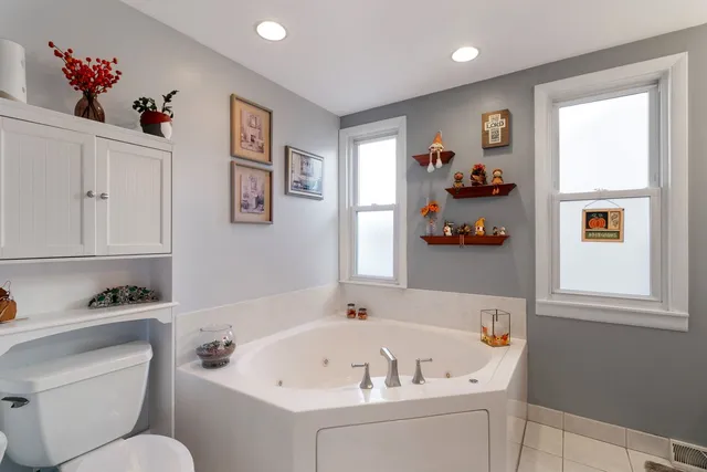 a bathroom with a bathtub sink and toilet