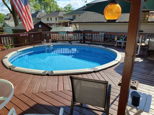a view of a chairs and table in the patio
