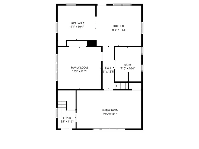 a picture of a building with a white fence