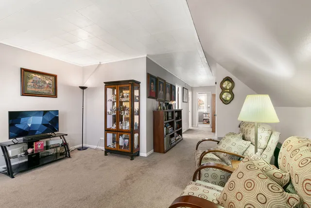 a bed room with furniture and a flat screen tv