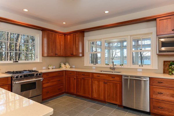651 Old Post Road Barnstable, MA 02635 - Photo 7 of 22 a kitchen with a sink stove and cabinets