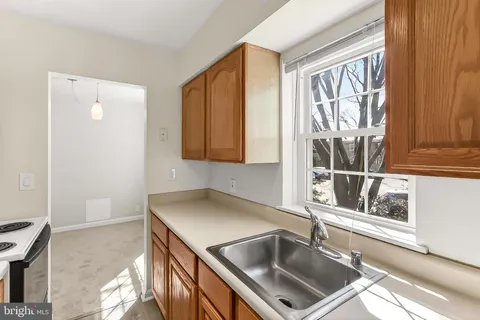 a kitchen that has a sink and a window