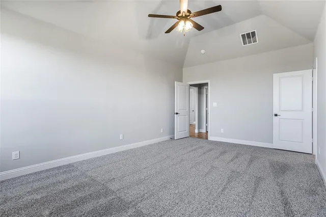 a spacious bathroom with a double vanity sink mirror and shower