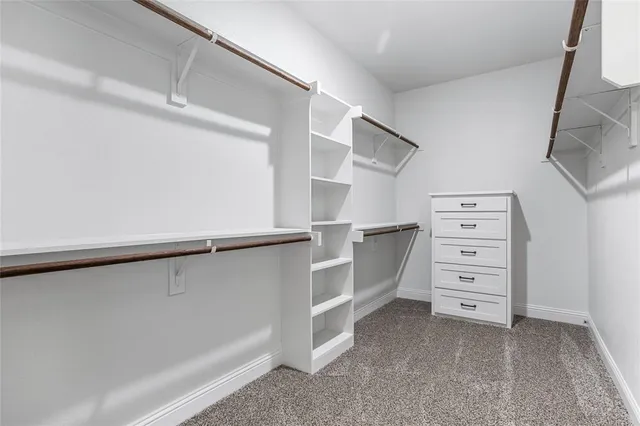 a bedroom with a bed and cabinets