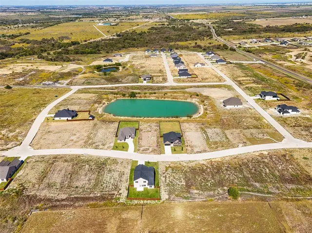 a view of residential houses with an ocean view