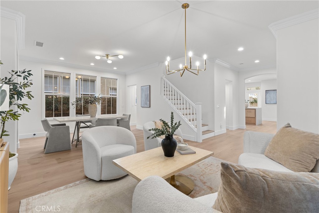 173 Parkside Drive Simi Valley, CA 93065 - Photo 11 of 31 a living room with furniture and a chandelier