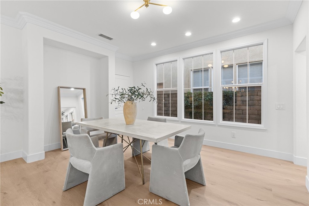 173 Parkside Drive Simi Valley, CA 93065 - Photo 12 of 31 a view of a dining room with furniture window and wooden floor