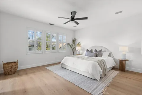 a bedroom with bed and window