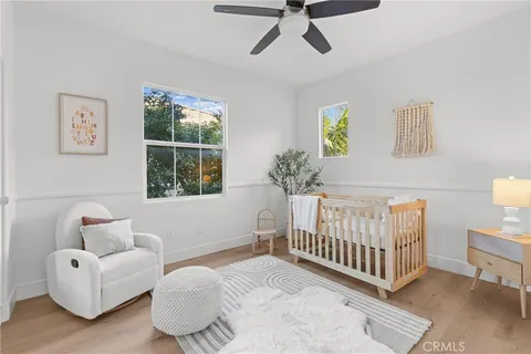 a bedroom with furniture and a window