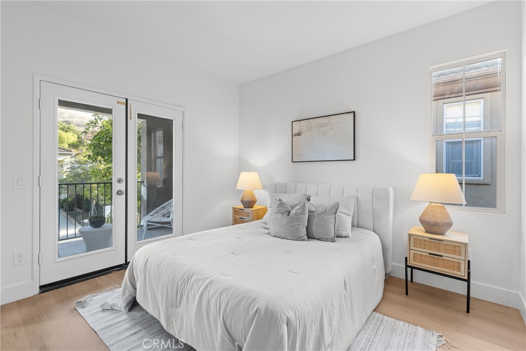 173 Parkside Drive Simi Valley, CA 93065 - Photo 22 of 31 a bedroom with a bed and wooden floor