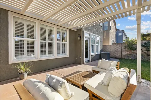 a view of a patio with a table and chairs