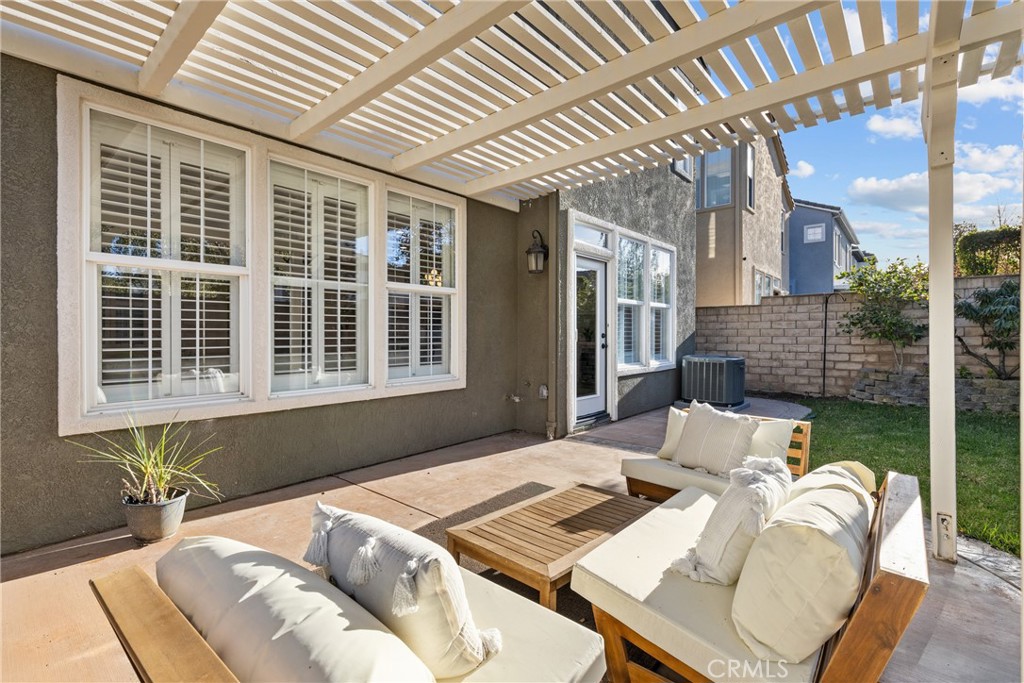 173 Parkside Drive Simi Valley, CA 93065 - Photo 25 of 31 a view of a patio with a table and chairs