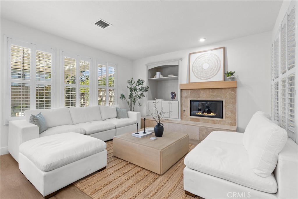 173 Parkside Drive Simi Valley, CA 93065 - Photo 4 of 31 a living room with furniture a window and a fireplace