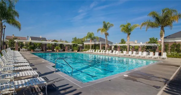 a view of a swimming pool with a yard