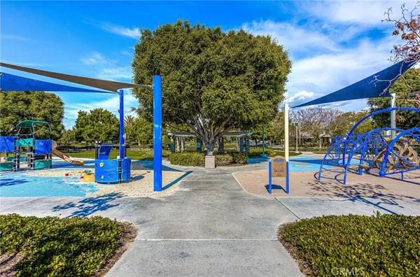 a view of a park with swings and slides