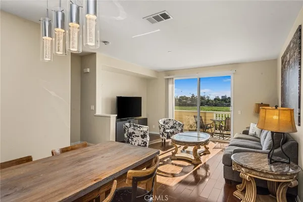 a view of a livingroom with furniture and a flat screen tv