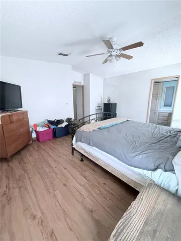 a kitchen with cabinets stainless steel appliances a sink and a window