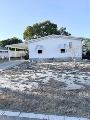 a kitchen with a sink and a stove top oven