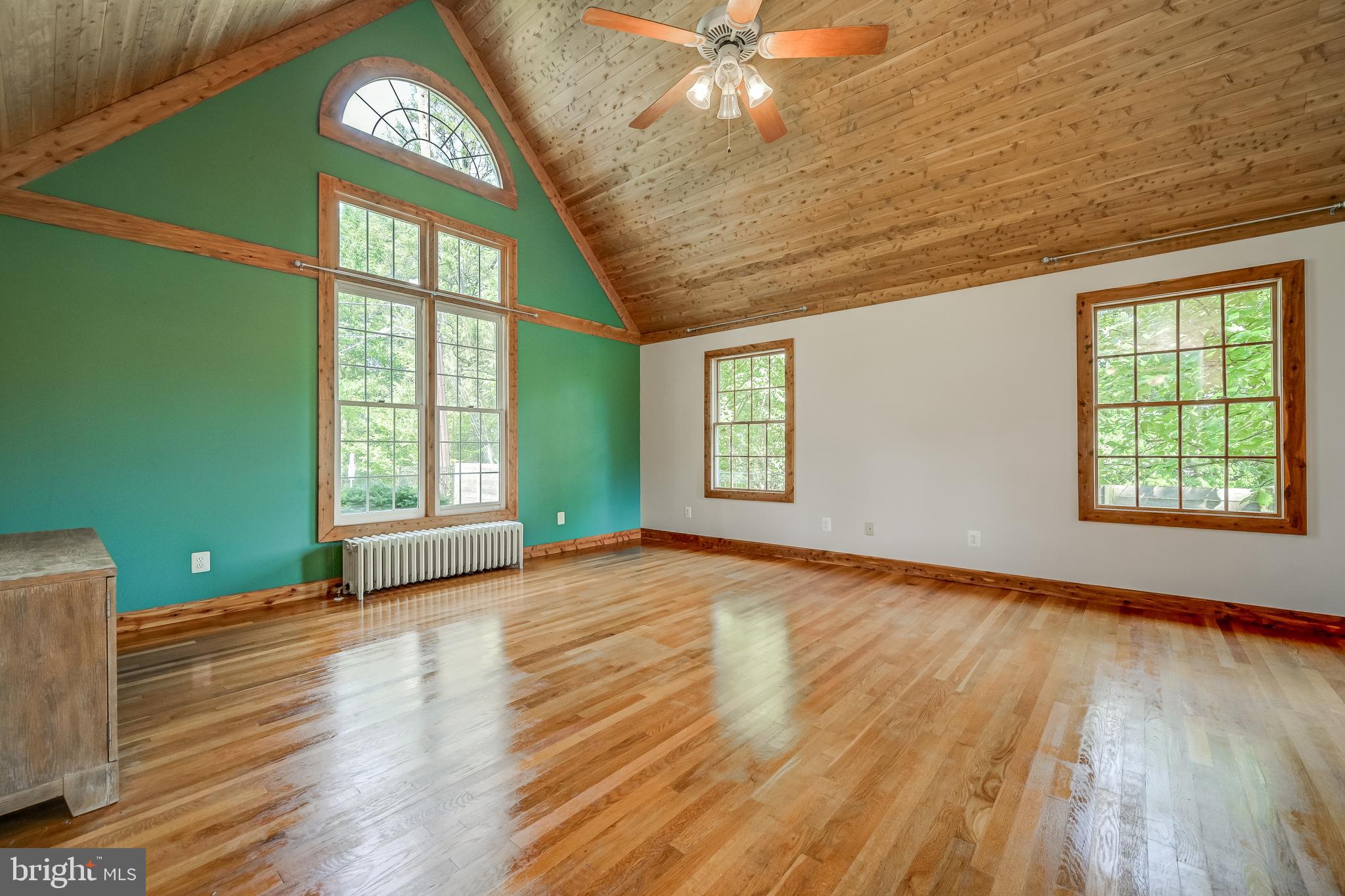 5 Lee Street Gaithersburg, MD 20877 - Photo 11 of 90 a view of an empty room with a window and wooden floor