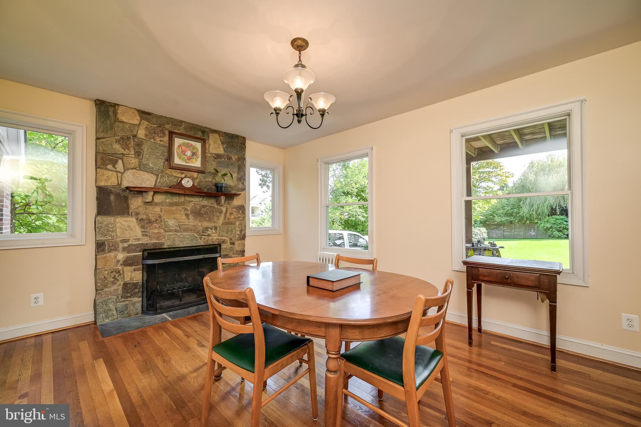 5 Lee Street Gaithersburg, MD 20877 - Photo 18 of 90 a dining room with furniture a chandelier and wooden floor