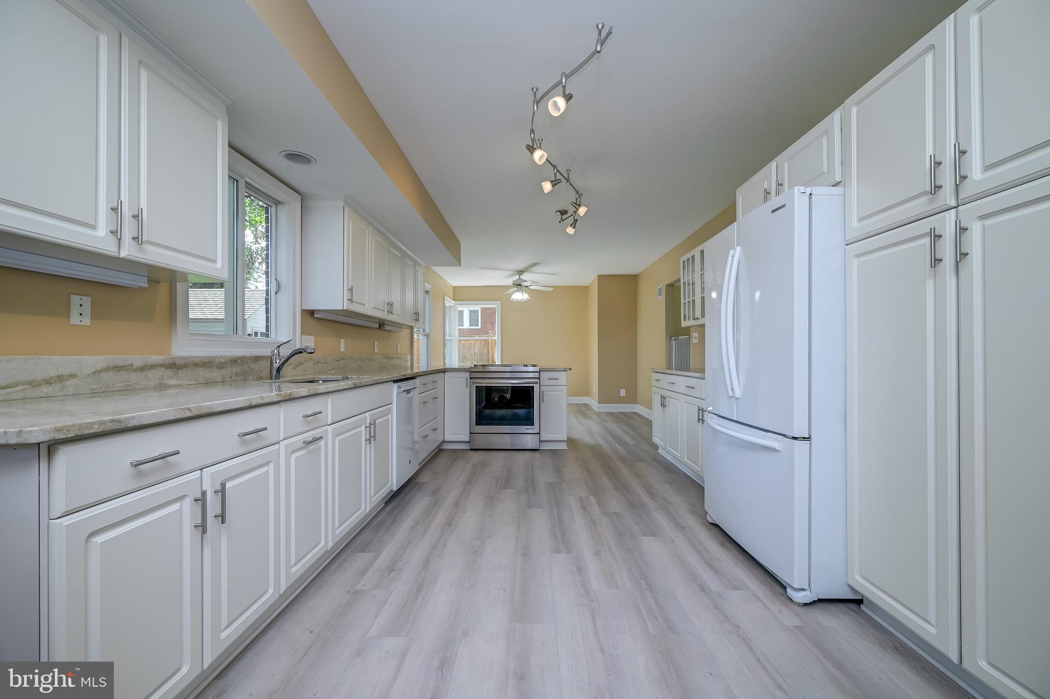 5 Lee Street Gaithersburg, MD 20877 - Photo 23 of 90 a large kitchen with cabinets wooden floor and stainless steel appliances