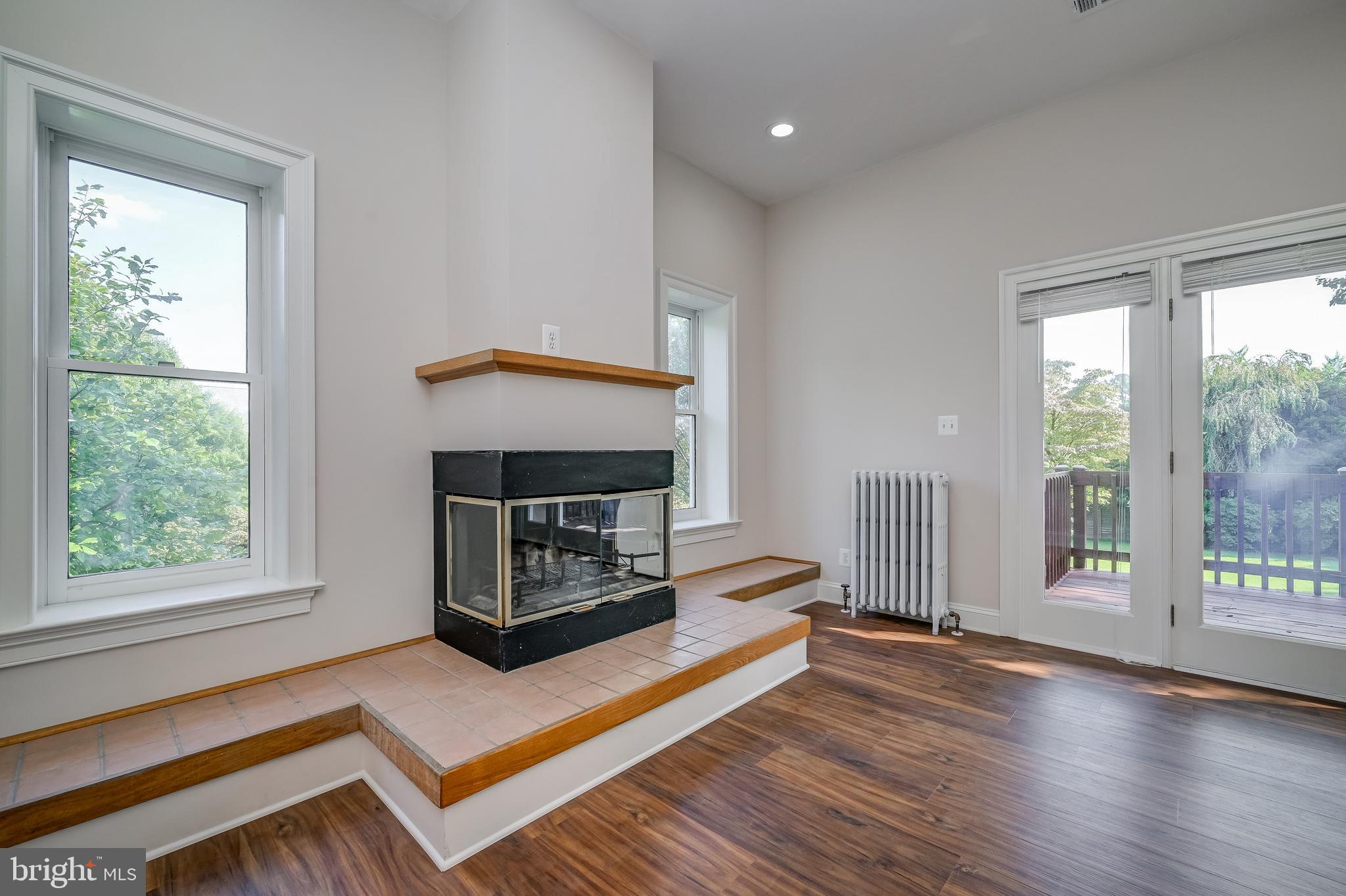 5 Lee Street Gaithersburg, MD 20877 - Photo 41 of 90 a living room with furniture a flat screen tv and a fireplace