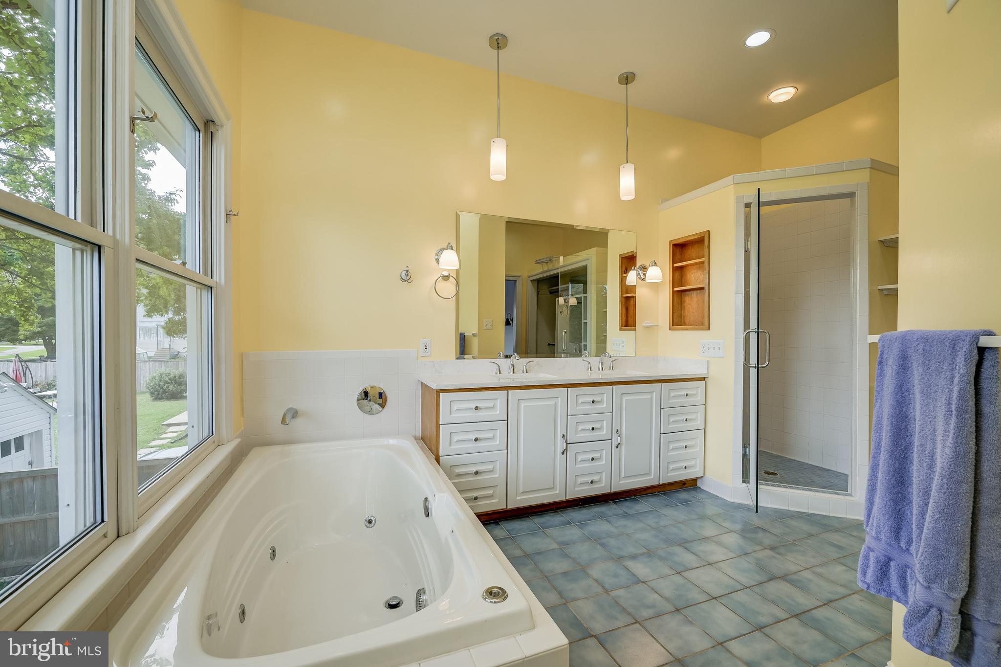5 Lee Street Gaithersburg, MD 20877 - Photo 48 of 90 a spacious bathroom with a tub sink and mirror
