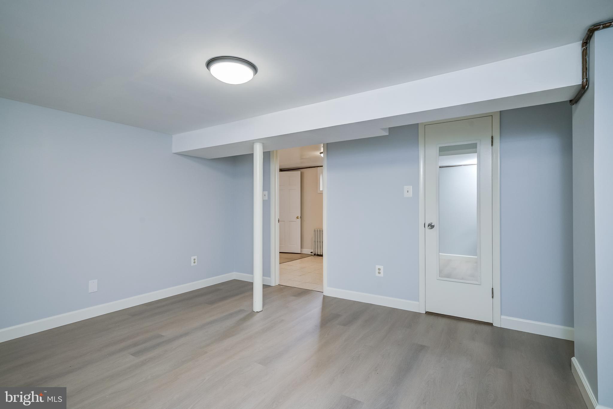 5 Lee Street Gaithersburg, MD 20877 - Photo 64 of 90 a view of an empty room with wooden floor and closet