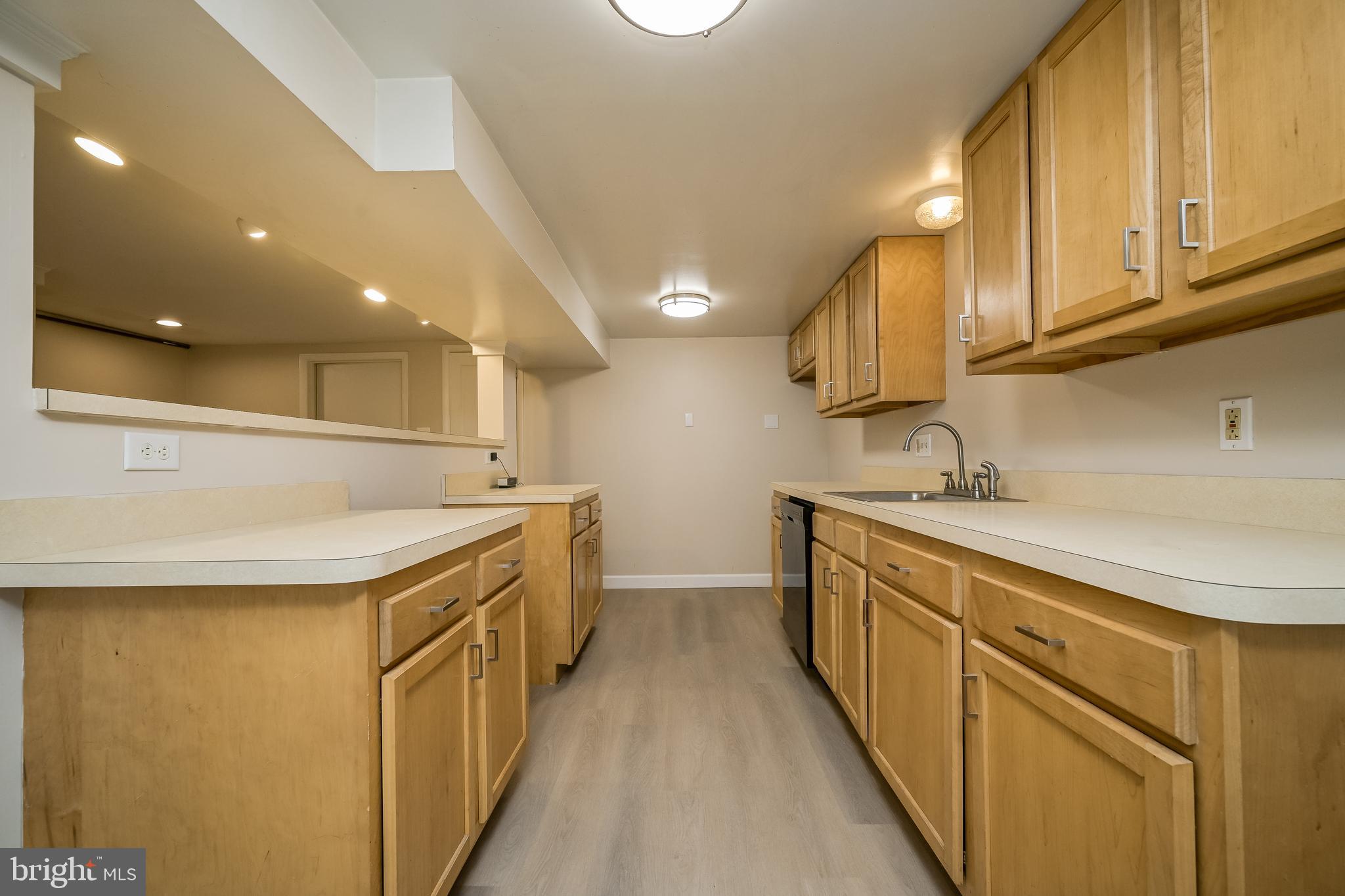 5 Lee Street Gaithersburg, MD 20877 - Photo 71 of 90 a kitchen with a sink and cabinets