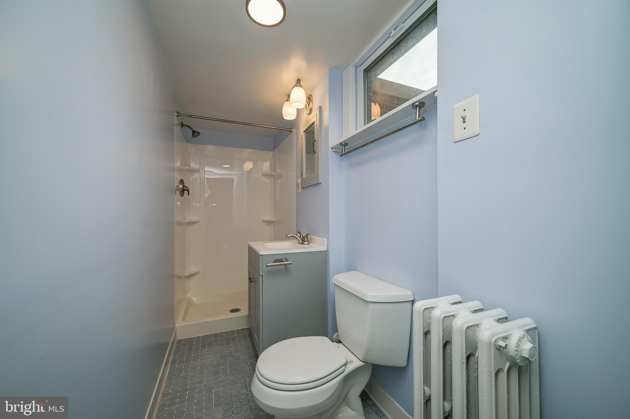 5 Lee Street Gaithersburg, MD 20877 - Photo 75 of 90 a white toilet sitting next to a bathroom sink