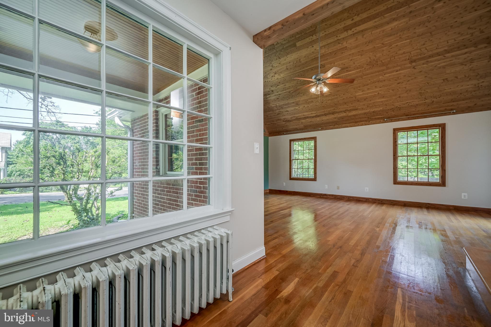 5 Lee Street Gaithersburg, MD 20877 - Photo 9 of 90 a view of an empty room with wooden floor and a window