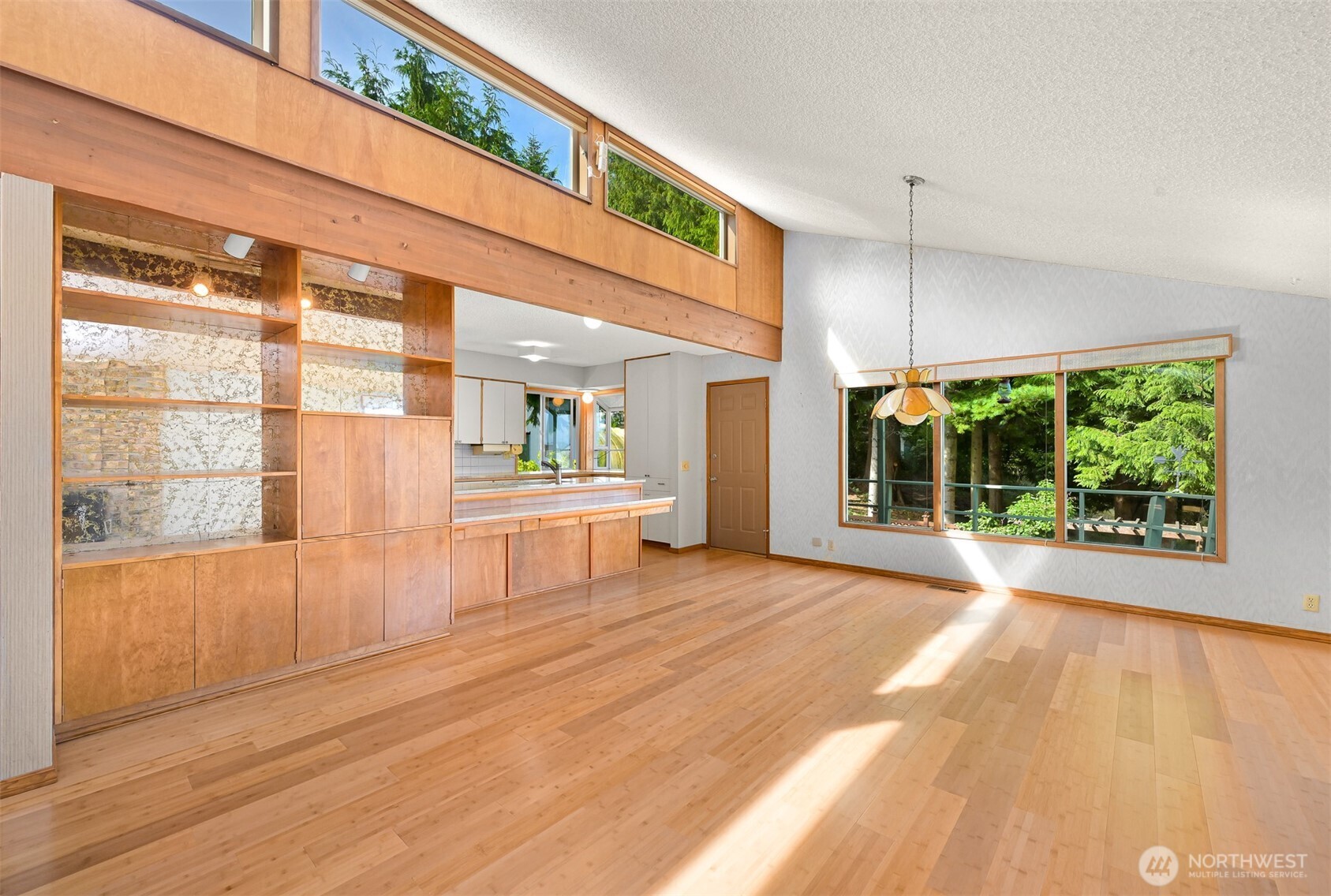 559 East Hemmi Road Lynden, WA 98264 - Photo 12 of 40 a view of an empty room with wooden floor and a window