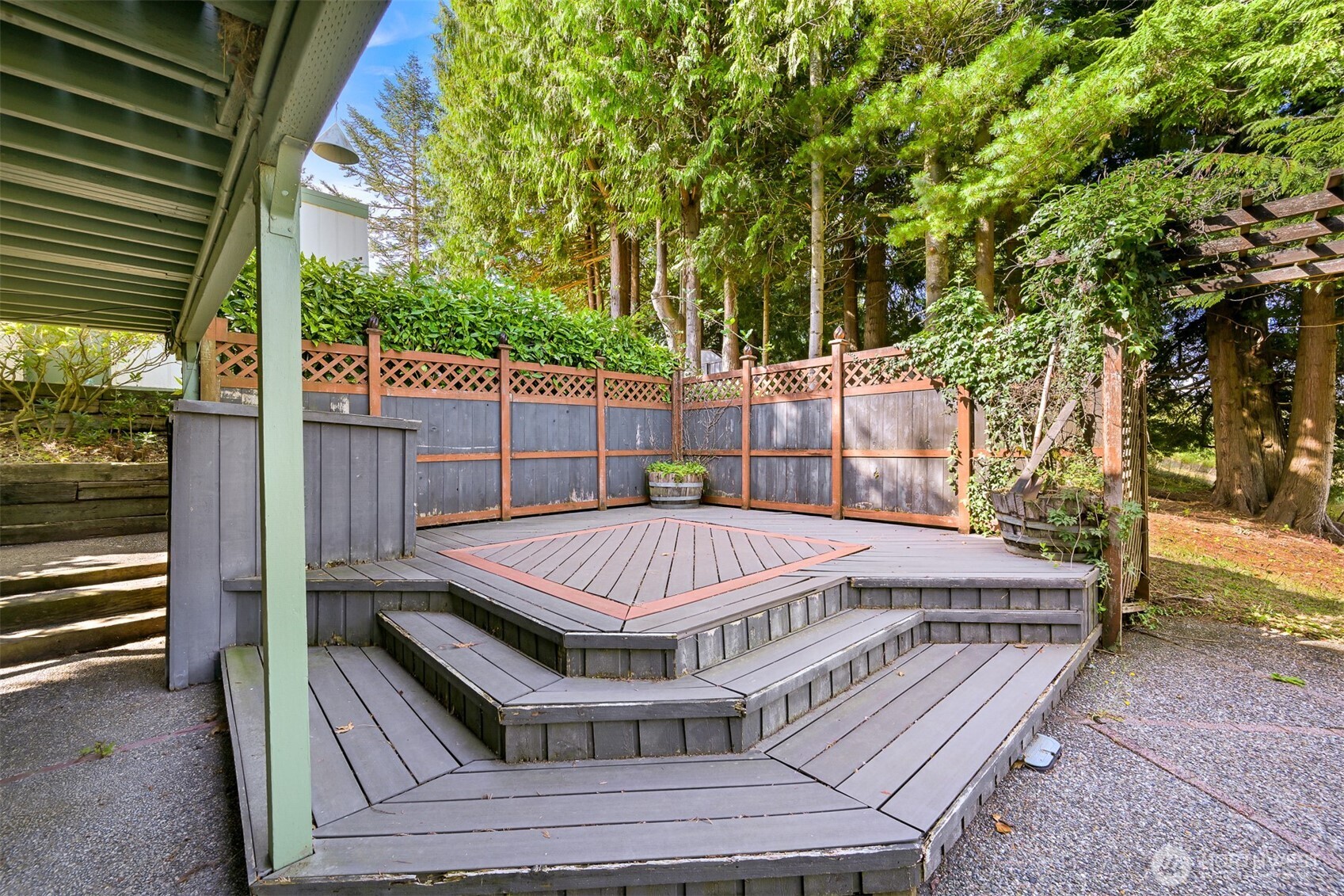 559 East Hemmi Road Lynden, WA 98264 - Photo 23 of 40 a view of a roof deck with wooden floor and fence