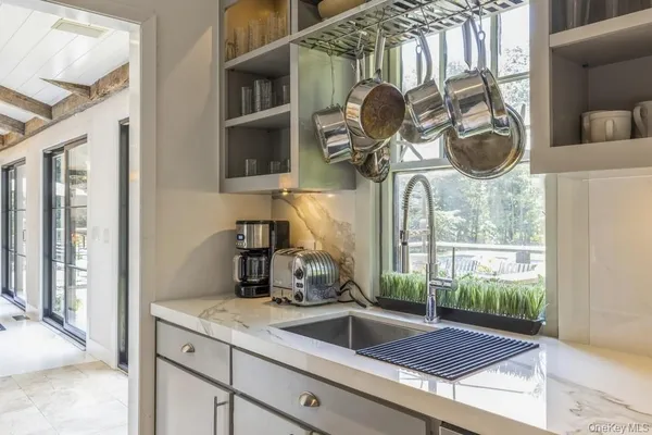 a kitchen with a sink and cabinets