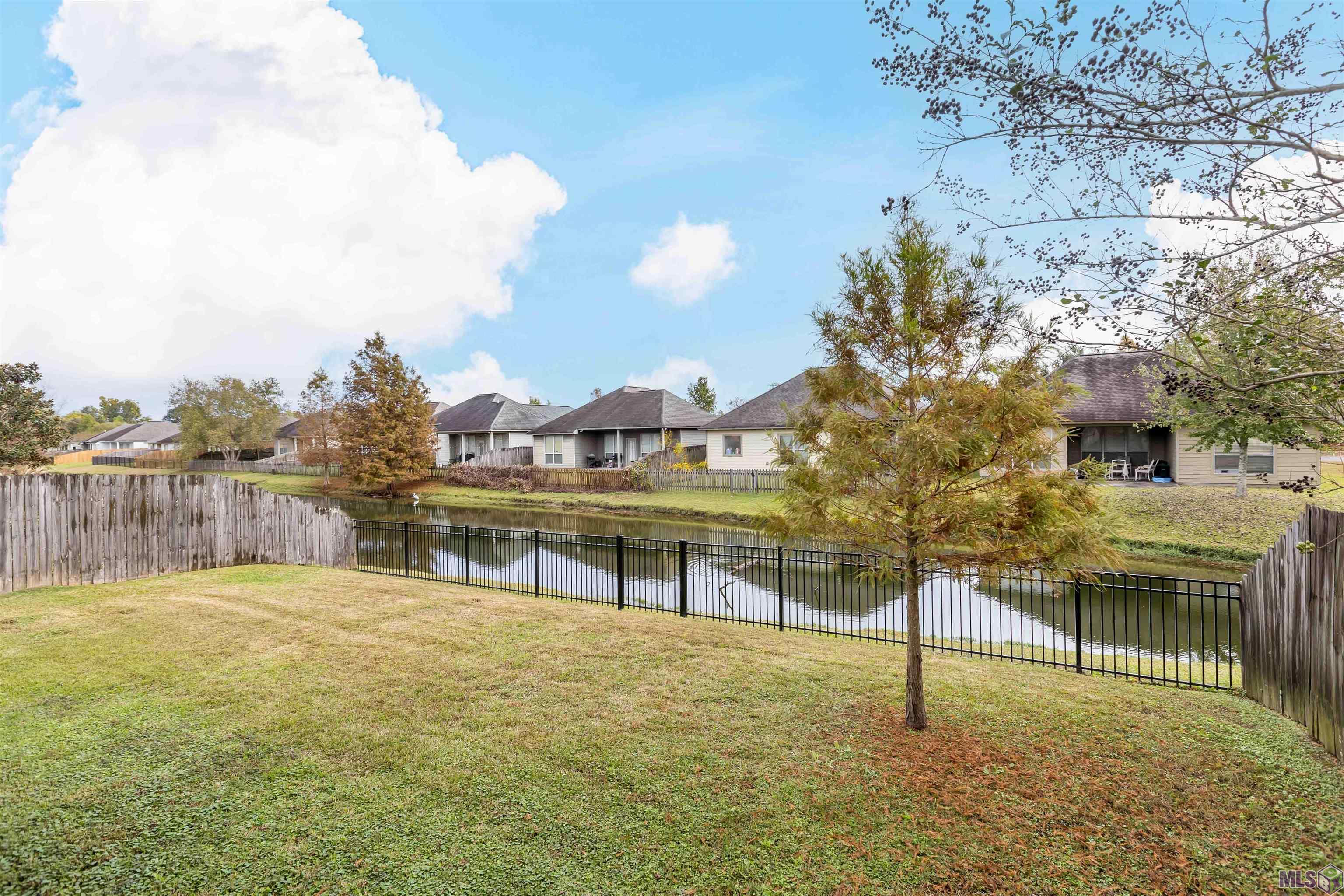 9089 Lake Mist Avenue Baton Rouge, LA 70810 - Photo 5 of 29 Backyard and lake view