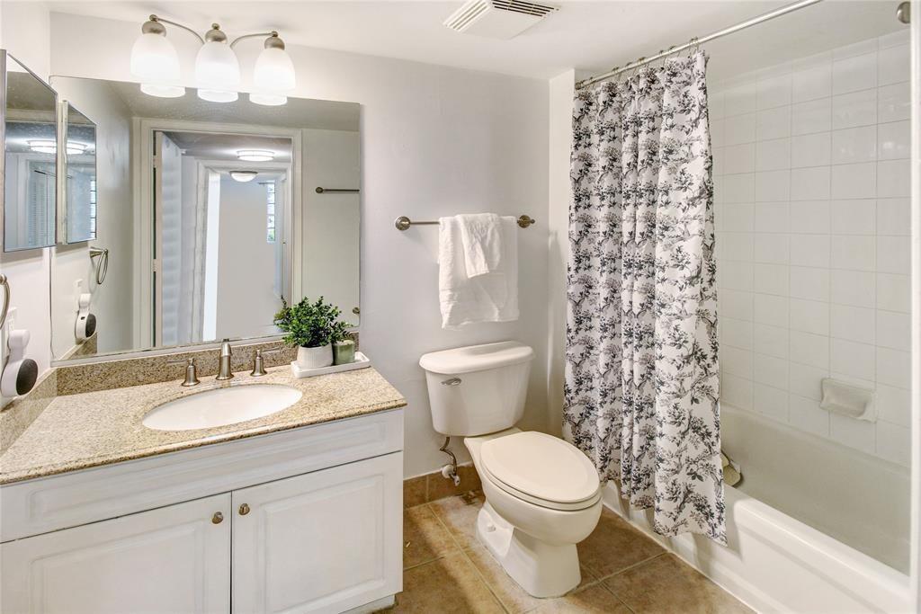 520 Southeast 5th Avenue, Unit 2605 Fort Lauderdale, FL 33301 - Photo 20 of 38 a bathroom with a sink toilet and shower
