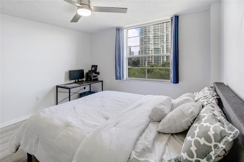 520 Southeast 5th Avenue, Unit 2605 Fort Lauderdale, FL 33301 - Photo 22 of 38 a bedroom with a bed and a window