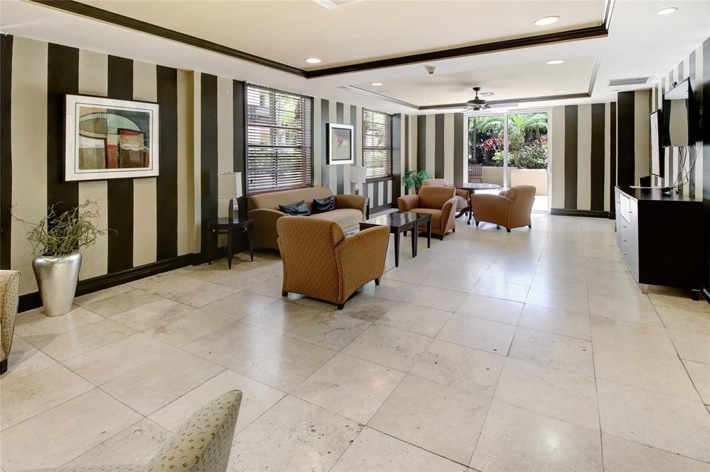 520 Southeast 5th Avenue, Unit 2605 Fort Lauderdale, FL 33301 - Photo 34 of 38 a living room with furniture and large windows