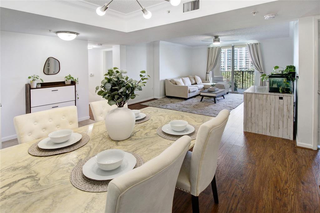 520 Southeast 5th Avenue, Unit 2605 Fort Lauderdale, FL 33301 - Photo 9 of 38 a view of a dining room with furniture and wooden floor