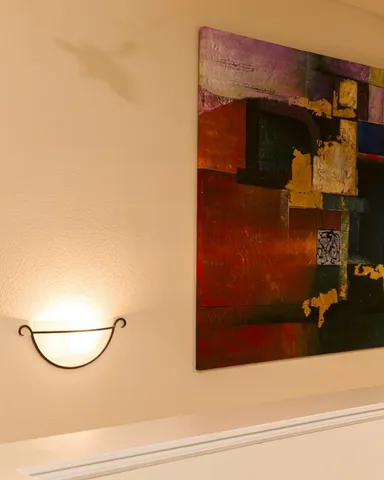 a kitchen with granite countertop a table chairs stove a sink and dishwasher