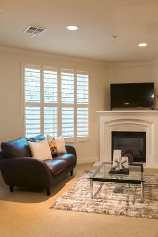 a kitchen with granite countertop a sink stainless steel appliances and cabinets
